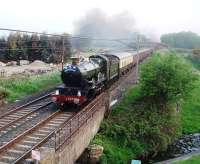 The ECS for Day 7 of the <I>Great Britain IV</I> hurries through Woodacre behind GWR Castle 4-6-0 5029 <I>Nunney Castle</I>. The empty train was on its way from Carnforth to Preston to start the leg to Bristol via the Welsh Marches route. Although not due to leave Preston until 8.43am the ECS movement ran 25 minutes early passing Woodacre at 6.55am. Its hard to believe that there have been two Castles on the main line in Lancashire in the space of one week [See image 33681]<br><br>[Mark Bartlett 22/04/2011]