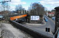 This view looks east to Cathcart station and shows the trackbed and missing bridge of the former Lanarkshire and Ayrshire 'Cathcart bypass' (forgive my description). It is surprising that during the works to slew the track onto their new alignment and junction that some method of building platforms on the route to Newton was not found.<br><br>[Ewan Crawford 27/03/2011]