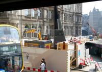 View from a no 37 bus at the east end of Princes Street on 21 April 2011. Hoarding surrounds the works at the top of Waverley Steps with pedestrian diversions in place. To the right is the temporary route between Princes Street and Waverley Station via Princes Mall.<br><br>[John Furnevel 21/04/2011]