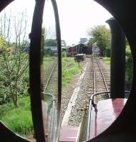 The fireman's view from Hunslet 0-4-0ST <I>Irish Mail</I> as it approaches Becconsall on the West Lancashire Light Railway. The sheds are on the left with the station through the small gap on the right. With thanks to the WLLR volunteer staff.  <br><br>[Mark Bartlett 25/04/2011]