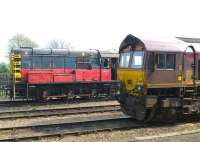 A touch of the ancient and modern at Didcot on 21 April 2011 with 66118 and 08757 standing alongside the station. The class 08 was duty shunter that day and must be at least 50 years old.<br>
<br><br>[Peter Todd 21/04/2011]