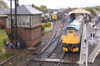 27001 draws the 15.35 to Manuel away from Bo'ness station on 23 April 2011. 37025 can be seen standing in the yard in the background.<br>
<br><br>[Bill Roberton 23/04/2011]