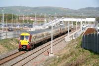 The 13.40 Helensburgh Central - Edinburgh Waverley runs into Armadale station on 27 April 2011. Photographed from the recently reopened bridge carrying the B8084 Station Road.<br><br>[John Furnevel 27/04/2011]