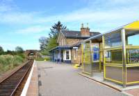 Looking north along the platform at Fearn towards Tain on 19 April 2011. The substantial main station building here is now a private house - with its 'replacement' in the foreground.<br><br>[John Gray 19/04/2011]