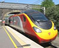 A Pendolino speeds through Tring in April 2010. <br><br>[Michael Gibb /04/2010]