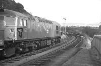 The late-running 10.10 Speyside trip freight from Aviemore heads out of Grantown-on-Spey East into the block section to Ballindalloch on Thursday 11th April 1968. While most distilleries were deliberately located adjacent or close to the railway, by the 1960s it was becoming increasingly hard for rail to compete with the flexibility of the modern lorry and the expansion of the trunk road network. Rail was volume-hungry, but most distilleries generated only a handful of full loads daily. Seven months later, this train was history.<br><br>[David Spaven 11/04/1968]