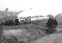 Preserved Duchess Pacific no 46229 'Duchess of Hamilton' steams westwards through Mirfield on 23 October 1982. The former Mirfield shed yard is in the left background and the trackbed of the old Midland branch to Newtown Goods Yard in Huddersfield in the foreground. The locomotive is en route from York to Chester to work the 'Welsh Marches Pullman'. [With thanks to Vic Smith and Eric Imrie]<br><br>[Bill Jamieson 23/10/1982]