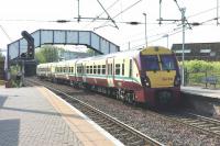 334 033 forming the 10.46 Ayr - Glasgow Central on 29 April running non-stop through Newton-on-Ayr.<br><br>[Colin Miller 29/04/2011]