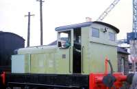 A young would-be driver daydreams in the cab of a Ruston diesel shunter at the former SRPS site in Springfield Yard, Falkirk in 1970. One of the Anderson - Grice cranes can be seen in the yard next door. <br>
<br><br>[John McIntyre //1970]