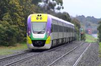 A VLocity DMU leaving Woodend northbound in the rain on its way from Melbourne to Bendigo. Photographed in October 2010, with the train about to disappear over a ski-jump. <br><br>[Colin Miller 06/10/2010]