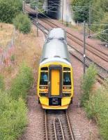 The siding destined to become the start of the Borders Railway route to Tweedbank [see image 33891]. View north on 1 August 2006 as a DMU leaves the turnback siding at the north end of Millerhill yard to run back to the platform at Newcraighall station on the other side of the bridge. 158740 had arrived there from Bathgate some 15 minutes earlier and would depart shortly as the next service to Dunblane.<br><br>[John Furnevel 01/08/2006]