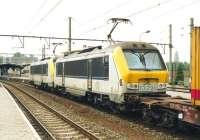 Luxembourg Railways (CFL) no 3018 and identical SNCB 1329 pass through Bruges with a container train for Zeebrugge, on 3 June 2004.<br>
<br><br>[Bill Roberton 03/06/2004]