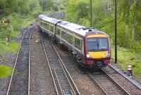 170 473 threads its way towards platform 1 at Dunblane after reversing off the down line on 10 May. To the left is the stub of the Callander line disappearing into the long grass. Made me wonder how many mechanical 'boxes still have point rodding as opposed to motors..... <br>
<br><br>[Bill Roberton 10/05/2011]