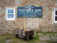 Replica/rebuilt narrow gauge wagon outside the Tan Hill Inn on the Pennine Way near the Cumbria/Durham/North Yorkshire boundaries. Presumably similar vehicles were used in the nearby stone quarries at this bleak spot (but if anyone has any more definite information please share). The nearest station to Tan Hill would have been Barras on the Stainmore line [See image 21928] but the road continues to climb the moors for a further five miles from Barras before reaching this windswept location. [With thanks to Messrs Martin, Armit and Taylor] [Editors note: Some may recall the Tan Hill Inn making the headlines on 31 December 2009 when revellers celebrating the New Year found the surrounding roads blocked by snow and were unable to leave the pub for 3 days.... [<I>somebody pinch me!</I>]   <br>
<br><br>[Mark Bartlett 28/04/2011]