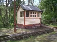 All is not as it seems at this railway oasis in mid-Wales. The station building [see image 26229] was originally wooden, and burnt down in 1998; the modern replacement is in brick and corrugated steel. This bijou little signal box is likewise not the original, having been transplanted from Newbridge-on-Wye, on the other side of Builth.<br><br>[Ken Strachan 08/05/2011]