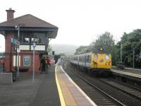 Scene at Carrickfergus on 9 May 2011 with a Larne train ariving.<br><br>[John Yellowlees 09/05/2011]