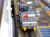 <I>Mule</I> locomotive no 181 assists the P&O liner 'Oceana' on its journey through the Panama Canal in November 2010. These rack mounted electric locomotives, fitted with powerful winches, are used for side-to-side and braking control on many of the larger vessels using the canal locks. Some of the biggest ships negotiating the locks (often leaving only a 2 ft clearance on each side) can require the combined assistance of 8 such <I>mules</I>. [See image 34074]<br><br>[Brian Smith 15/11/2010]