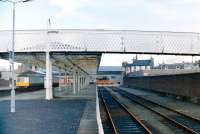 Largs in 1986 showing the doomed platform and carriage siding. From right to left stand former Platform 1 (with boundary wall built on it), followed by 2, 3 and 4 - the latter with a dmu alongside.<br><br>[Colin Miller //1986]