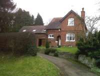 Unlike the station [see image 32799], the station master's house at Woodford Halse is in fine condition in February 2011. It's a fair bet that the bit on the left wasn't a double garage in Edmund Watkin's day.<br><br>[Ken Strachan 04/02/2011]