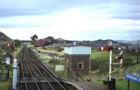 The signal is off for a Lanark-bound DMU in this September 1964 view east from Douglas West station, a few weeks before the complete closure of the line. The rail-served coal mine in the middle distance is a reminder that if the line had survived for freight, it would have been carrying massive quantities of open cast coal over the last 25 years - traffic which instead went by road to the Ravenstruther railhead near Carstairs.<br><br>[Frank Spaven Collection (Courtesy David Spaven) /09/1964]