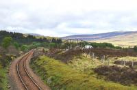 Built from old rails and sleepers, snow fences used to protect the railway lines from drifting snow. This is what remains of the snow fences south of Rannoch Station in May 2011.<br>
<br><br>[John Gray 14/05/2011]