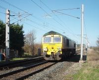 Light engine movement at Hest Bank as Freightliner 66545 heads south over the level crossing. The line between Lancaster and Carnforth is very busy and the crossing barriers at Hest Bank and Bolton-le-Sands are often down for lengthy periods while several trains pass. <br><br>[Mark Bartlett 08/04/2011]