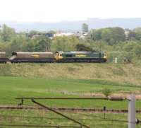 End of the line. Looking east from the A70 towards the buffer stops at the end of the reversing siding at Ravenstruther on 15 May 2008. Freightliner 66509 has recently arrived off the WCML with coal empties and the driver is currently awaiting clearance before reversing his train along the siding running across the centre of the photograph and under the loading gantry.<br><br>[John Furnevel 15/05/2008]