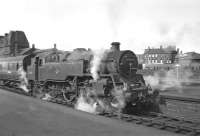 As far as I can remember, my first ever railway photograph - Standard Class 4 2-6-4T No. 80009 awaits departure from Ayr with a Glasgow (St. Enoch) train in August 1959.  The smokebox of classmate No. 80008 can just be seen in the background beyond the wall alongside one of the new dmus which would take over from the tanks with effect from the timetable change later that year. Note the CR type route indicator above the centre of the buffer beam, something I never noticed on the original print. [Perhaps someone with a summer 1959 timetable can identify the train.] <br>
<br><br>[Bill Jamieson /08/1959]