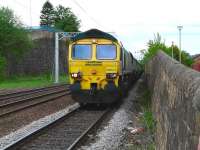 Freightliner 66513 with the 4C07 return Longannet PS to Ravenstruther coal empties held in the loop at Coatbridge Central on 11 May.<br><br>[Ken Browne 11/05/2011]