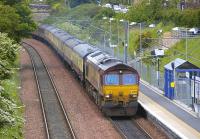 66099 with the empty stock of <I>'The Lothian Tornado'</I> passing Brunstane bound for Millerhill on 17 May. BR Standard Pacific no 71000 <I>Duke of Gloucester</I> was on the rear of the train [see image 34130].<br><br>[Bill Roberton 17/05/2011]