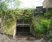 All that remains of the Glasgow Central Railway tunnel under Garrioch Road (now partially infilled) in May 2011.  The tunnel once gave access to Maryhill Central station, closed to passengers in October 1964. [See image 10336]<br><br>[Veronica Clibbery 07/05/2011]