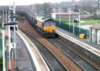 EWS 66229 has just crossed the bridge over the A9 on the west side of Falkirk on 10 December 2004. The locomotive is about to run west through Camelon station with returning coal empties from Longannet power station bound for Hunterston import terminal. <br><br>[John Furnevel 10/12/2004]