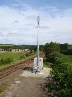 A GSM radio mast and cabin erected recently by the former Crigglestone West station overbridge. It is erected almost on the site of the platelayers hut that once stood here [see image 23445]. Crigglestone Junction signal box was sited on the far side of the line immediately to right of the mast.<br><br>[David Pesterfield 21/05/2011]