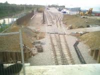 Significant progress on the expansion at DIRFT since my last visit here [see image 33773]. View is towards Rugby on 20 May 2011, with rails shown in place here on the north west side of the A5. The wagon in the middle distance looks like it is being used in loading tests.<br><br>[Ken Strachan 20/05/2011]