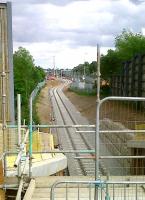 Progress at DIRFT looking south east towards the main depot and yard on 20 May [see image 33772] with rails now passing under the A5. The class 66 lurking in the undergrowth on the right is no 708.<br><br>[Ken Strachan 20/05/2011]