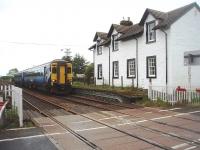 156501 passes the old platform at Dunragit as it draws to a halt in the loop for the token exchange. This covers the next single line section to Glenwhilly. The train is the 1005 Stranraer to Glasgow Central. <br><br>[Mark Bartlett 23/05/2011]