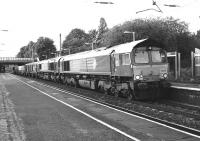 A southbound nuclear flask train passes through Leyland station <br>
late in the evening of 18 May 2011. It is not unusual for several locomotives to be included in the train. On this occasion two Class 66s were joined by a further two Class 20s which were being taken south to work another flask train the following day.<br>
<br><br>[John McIntyre 18/05/2011]