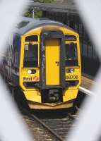 <I>You've been framed!</I> 158 736 seen through the latticework of Cowdenbeath's footbridge on 23 May, awaiting departure with the 13.23 to Edinburgh.<br>
<br><br>[Bill Roberton 23/05/2011]