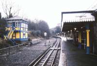 A wet platform in Metroland. View south east towards London from the buffer stops at the colourful Metropolitan Line terminus at Chesham in October 1988.<br><br>[Ian Dinmore /10/1988]