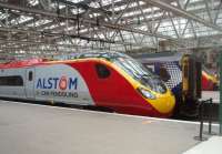 The 11-car <I>Pendolongo</I> prototype 390054 rests briefly in Platform 2 at Glasgow Central bewteen test runs on 25 May. This was a chance encounter while changing trains here. Note the Alstom crest on the nose - a reminder that Virgin had yet to agree terms for its use although around the time this photo was taken it was announced that the train would be taken on by Virgin but only initially as a nine car set. Long but not for much longer. <br><br>[Mark Bartlett 25/05/2011]