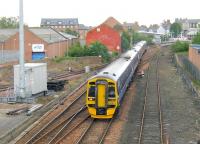 158871 + 170434 leaving Arbroath on 25 May 2011 with an Edinburgh-Aberdeen train.<br><br>[Sandy Steele 25/05/2011]