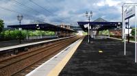 It's out with 'Strathclyde Red' and in with 'ScotRail Blue' for Dumbarton Central's canopies. It's all looking rather smart with the new paint and resurfaced platforms.<br><br>[Ewan Crawford 12/05/2011]