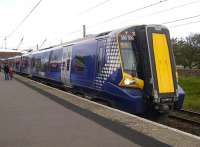 380009 glides to a halt at Ardrossan South Beach on 26 May with the 13.11 Largs - Glasgow Central.<br><br>[Ken Browne 26/05/2011]