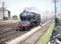 Light engine at Saughton Junction in the spring of 1961. D49 4-4-0 no 62729 <I>Rutlandshire</I> passes a group of young enthusiasts standing in the adjacent field. The locomotive was finally withdrawn from St Margarets shed in May 1961 and cut up at Darlington Works later the same month.   <br><br>[A Snapper (Courtesy Bruce McCartney) 31/07/1959]