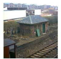 The brave new world of Livingston new town makes for a strange contrast with a traditional North British Railway building at the former Livingston station (closed 1948), seen here on 23rd February 1965.<br><br>[Frank Spaven Collection (Courtesy David Spaven) 23/02/1965]