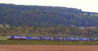 A Stobart Rail container train, complete with locomotive<br>
66414 <I>'James The Engine'</I>, drifts down towards the level crossing at Forteviot on 28 May.<br><br>[Brian Forbes 28/05/2011]