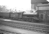 Gresley J39 0-6-0 no 64733 standing in the yard alongside Hawick shed in March 1959.<br><br>[Robin Barbour Collection (Courtesy Bruce McCartney) 21/03/1959]