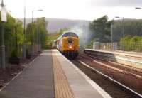 Platform scene at Carrbridge on 28 May as the The North Berwick - Kyle of Lochalsh SRPS <I>Kyle Crusader</I> hauled by Deltic 55022 <I>Royal Scots Grey</I>, runs through the station.<br><br>[Gus Carnegie 28/05/2011]