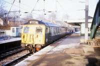 A class 304 emu no 304 402 calls at Four Oaks station on the Birmingham - Lichfield line in December 1992.<br><br>[Ian Dinmore /12/1992]