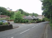 The grey house in the foreground sat at the buffers end of Portpatrick station platform although the station buildings themselves, which were behind it, have disappeared along with all other traces of the railway. View is west towards the coast in May 2011, with Old Station Court, a modern housing development, now occupying the station site. Trains climbed away from the camera before turning through 180 degrees to head for Stranraer. The road drops down to the village and harbour.<br><br>[Mark Bartlett 27/05/2011]